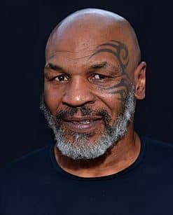 Mike Tyson during a public appearance, symbolizing his journey from boxing legend to successful entrepreneur.