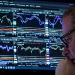 Traders on the New York Stock Exchange floor amid market volatility