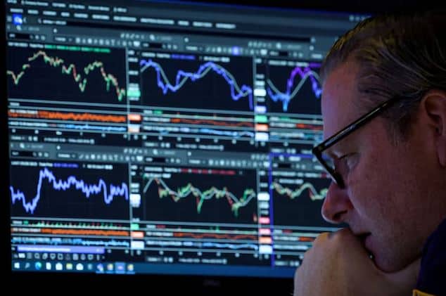 Traders on the New York Stock Exchange floor amid market volatility